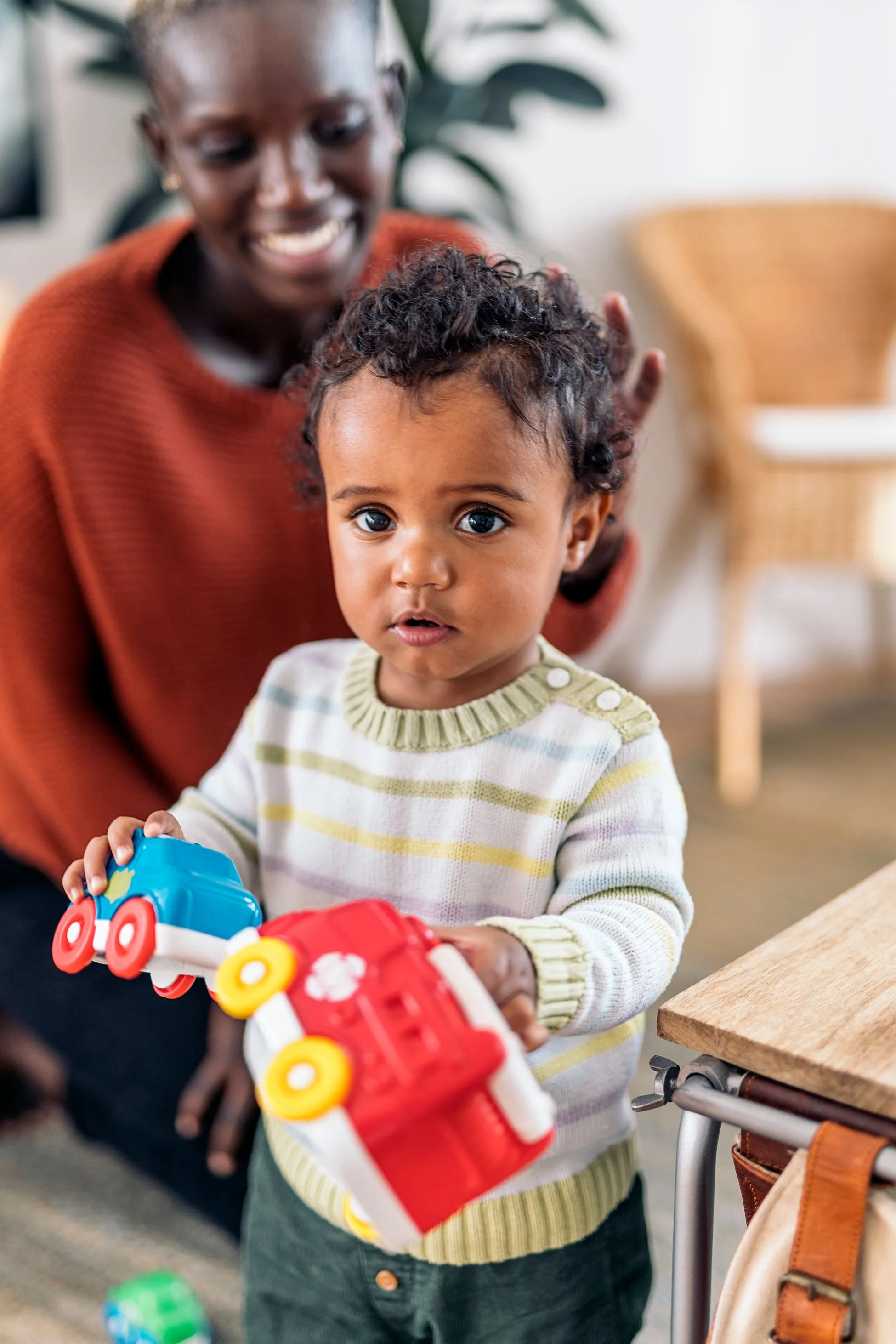 baby playing with trucks